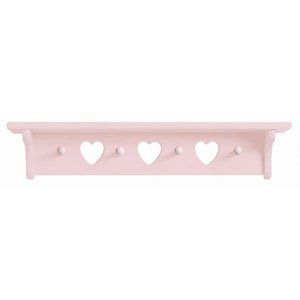 a pink shelf with three hearts on the top and two holes in the middle,