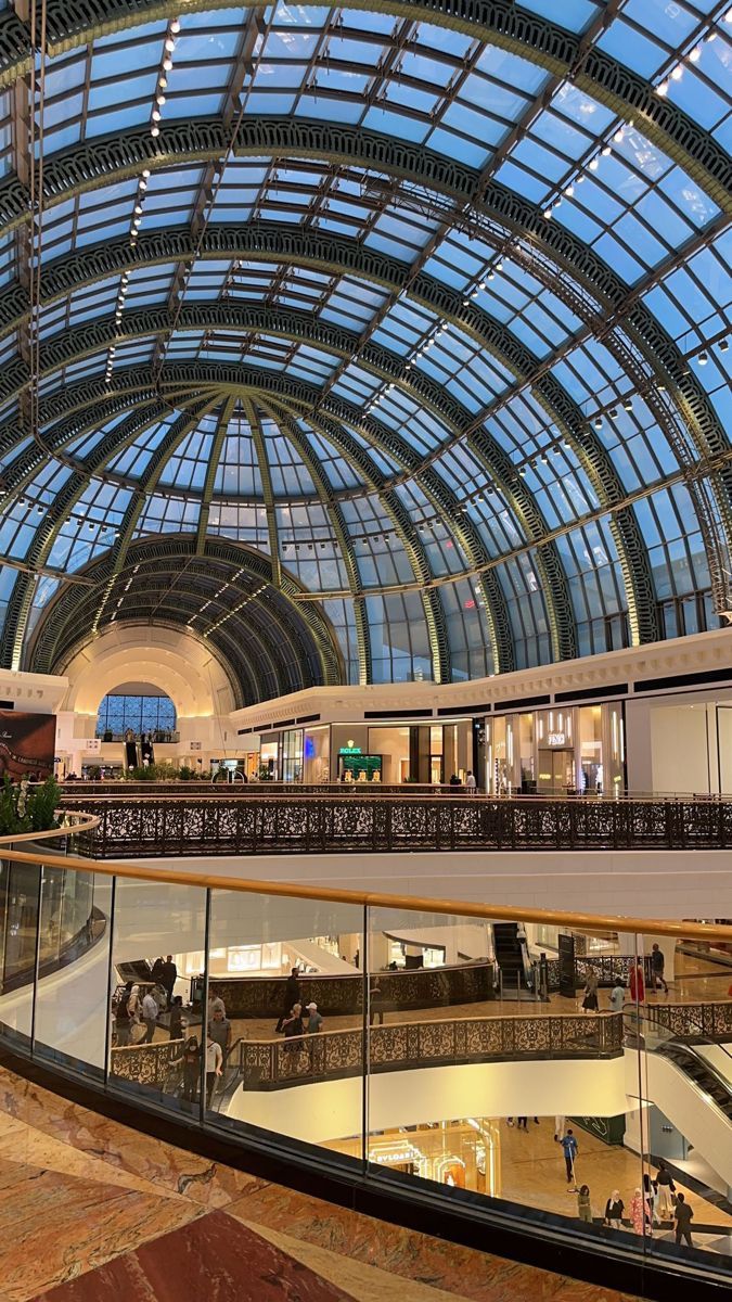 the inside of a large building with glass ceiling