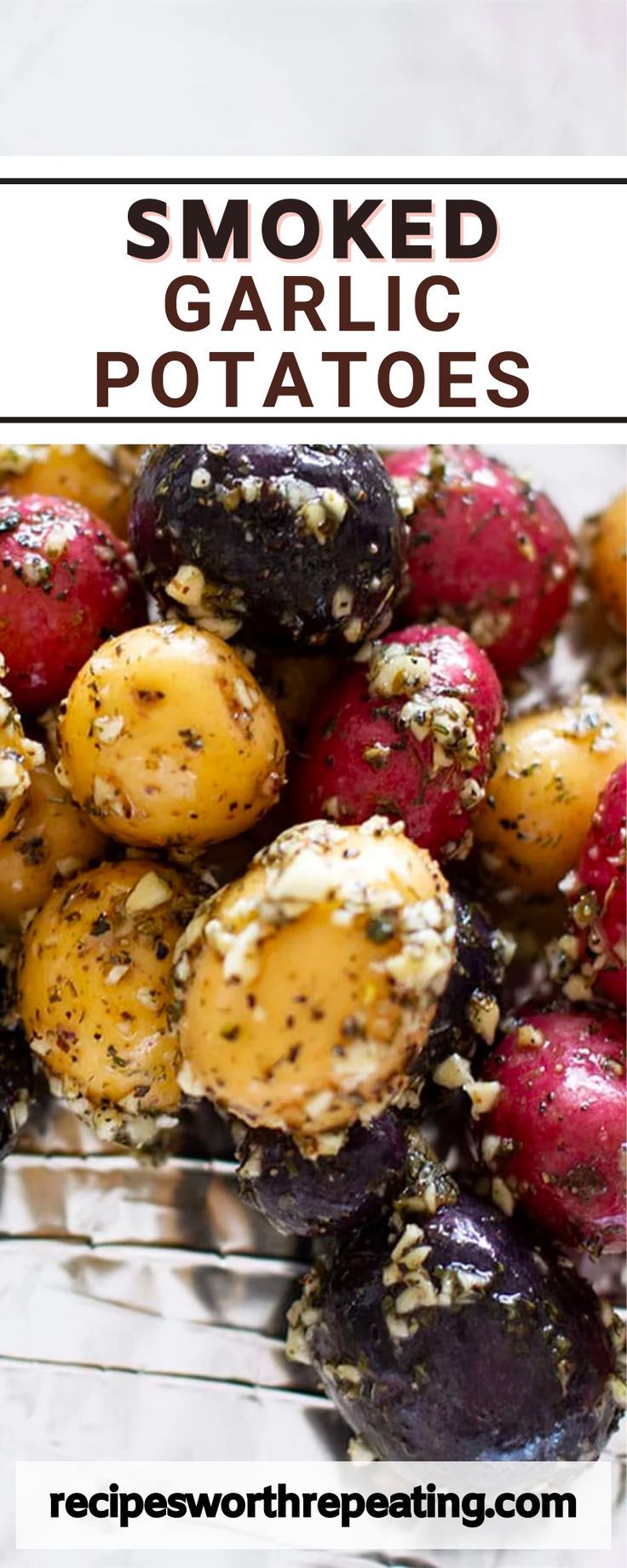 roasted garlic potatoes in a glass bowl with text overlay that reads smoked garlic potatoes