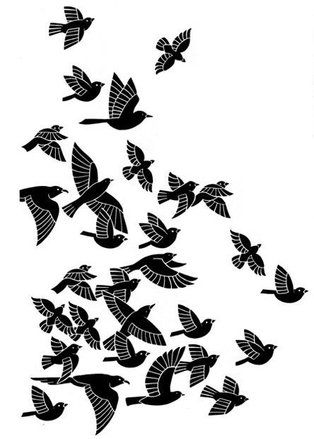 a flock of birds flying through the air