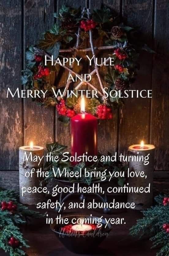 a candle and wreath with the words happy yule and merry winter solstice