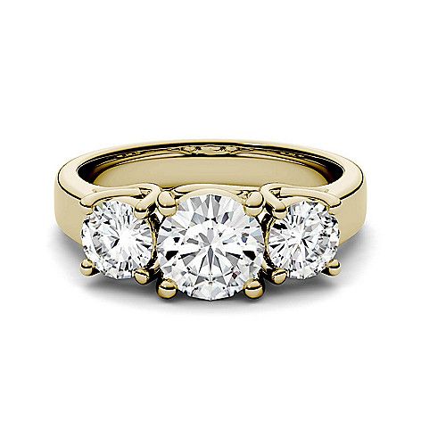 three stone engagement ring in yellow gold with diamonds on the sides and four stones at the top