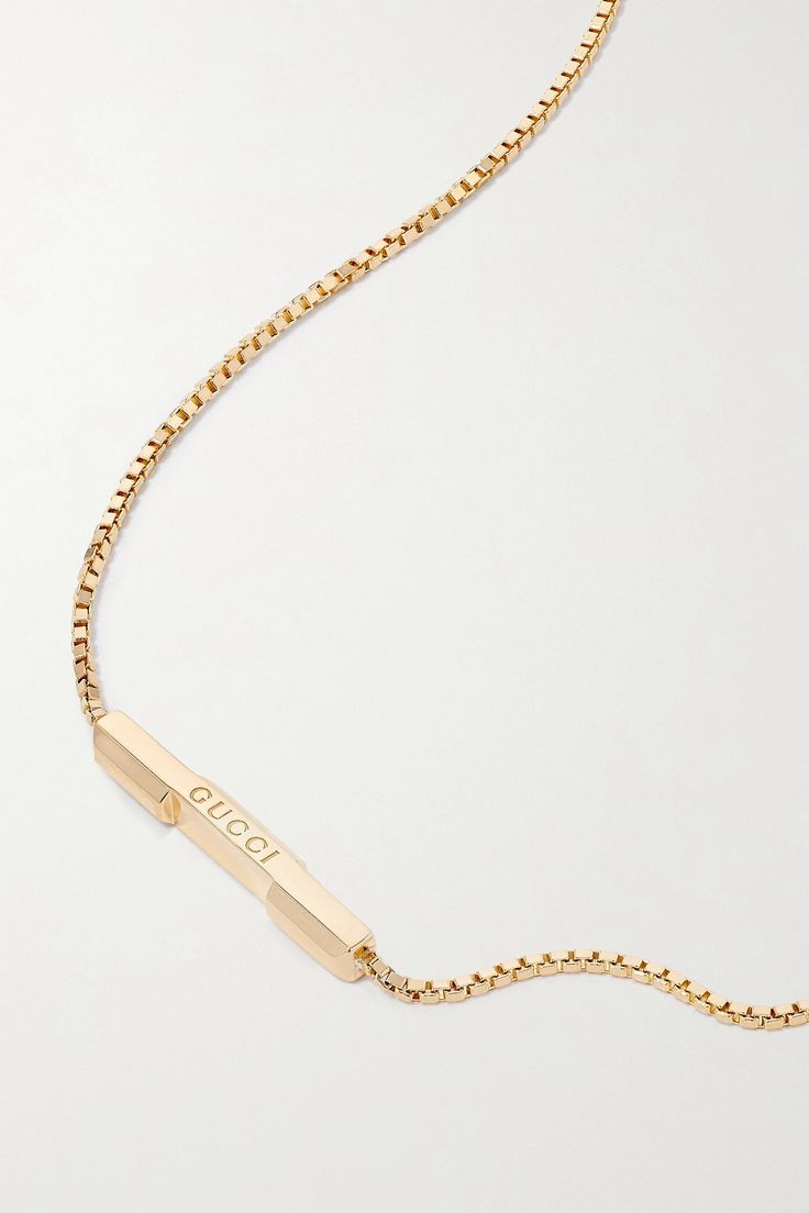 Gucci's necklace is part of the label's 'Link to Love' collection, which explores modern romance. It has been made in Italy from polished 18-karat gold and strung with a slim bar etched with the brand's name. The chain is adjustable, so you can wear it shorter or longer, depending on what you're layering it with. Designer Necklace With Adjustable Chain For Gift, Gucci Necklace With Polished Finish As Gift, Gucci Necklace With Polished Finish For Gift, Elegant Gucci Necklace With Polished Finish, Gucci Polished Finish Necklace For Gift, Designer Yellow Gold Necklaces With Polished Finish, Designer Yellow Gold Polished Necklace, Designer Yellow Gold Necklace With Polished Finish, Gucci Sterling Silver Jewelry With Polished Finish