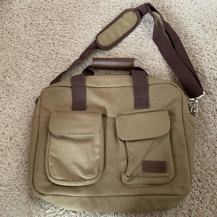 Never Used-Perfect Condition! Bella Rosa Bag - Messenger Bag, Laptop Bag, Briefcase, Whatever You Need It To Be! Exterior Is Olive Green/Light Brown Canvas With Brown Nylon Straps And Brown Leather Accents. Two Exterior Pockets And Removable Shoulder Strap. Interior Is Black Nylon With Four Compartments. 12” X 11” X 3”. Rectangular Khaki Satchel For Everyday Use, Rectangular Khaki Satchel For Travel, Khaki Rectangular Satchel For Everyday Use, Khaki Rectangular Satchel For Travel, Khaki Crossbody Canvas Bag For Travel, Khaki Travel Pouch Bag, Khaki Satchel For Everyday Use, Khaki Satchel Backpack For Travel, Rectangular Khaki Travel Satchel