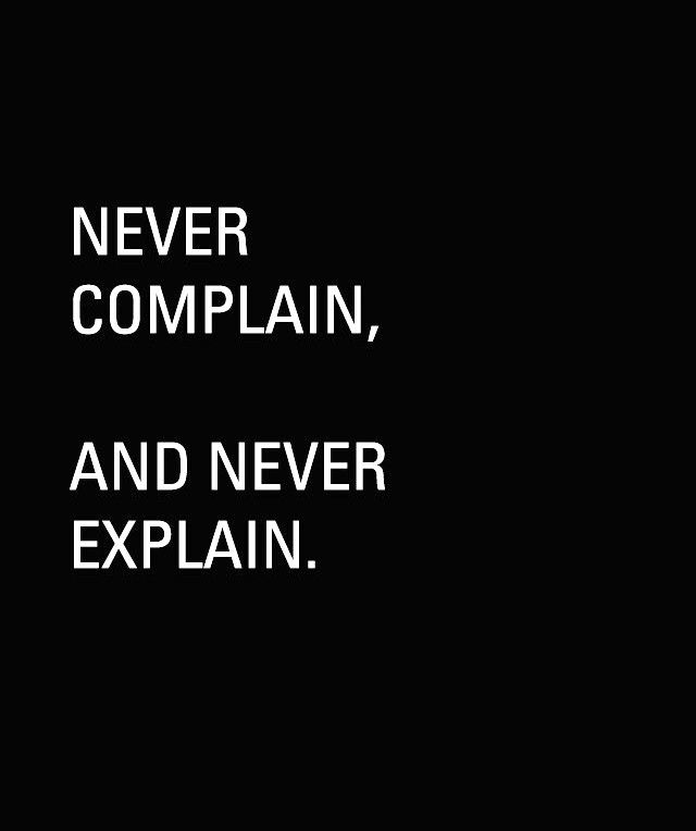 the words never complain, and never explain in white on a black background