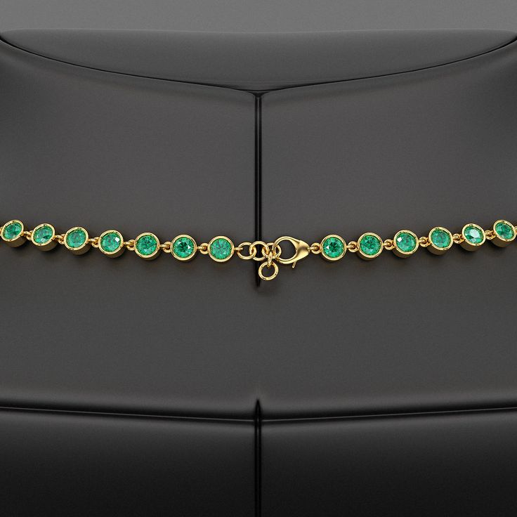 Adorn her with timeless elegance with our 9.36 Carat Natural Emerald Choker Necklace in 14K Gold. This bezel-set, round-cut art deco design showcases the vibrant May birthstone, making it a perfect customized birthday gift for her. Exuding luxury and sophistication, this stunning necklace is a refined statement piece crafted to celebrate life’s special moments. 𝐅𝐞𝐚𝐭𝐮𝐫𝐞𝐬:• 𝐌𝐚𝐝𝐞 𝐭𝐨 𝐎𝐫𝐝𝐞𝐫• 𝐌𝐞𝐭𝐚𝐥: 𝟏𝟎𝐊 𝐆𝐨𝐥𝐝 | 𝟏𝟒𝐊 𝐆𝐨𝐥𝐝 | 𝟏𝟖𝐊 𝐆𝐨𝐥𝐝 • 𝐁𝐚𝐧𝐝 𝐂𝐨𝐥𝐨𝐫𝐬: Ro Classic Formal Emerald Necklace Hallmarked, Classic Formal Hallmarked Emerald Necklace, Luxury Hand Set Round Emerald Necklace, Classic Formal Emerald Necklace, Luxury Gold Emerald Necklace With Brilliant Cut, Luxury Emerald Necklace With Brilliant Cut, Luxury Round Diamond Necklace Hand Set, Classic Emerald Gemstone Necklace For Formal Occasions, Formal Round Emerald Necklace Fine Jewelry