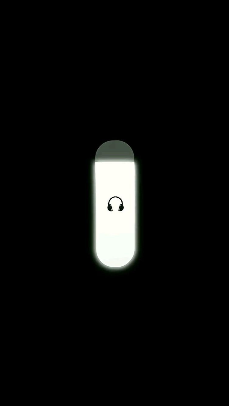 an illuminated door with a smiley face in the dark