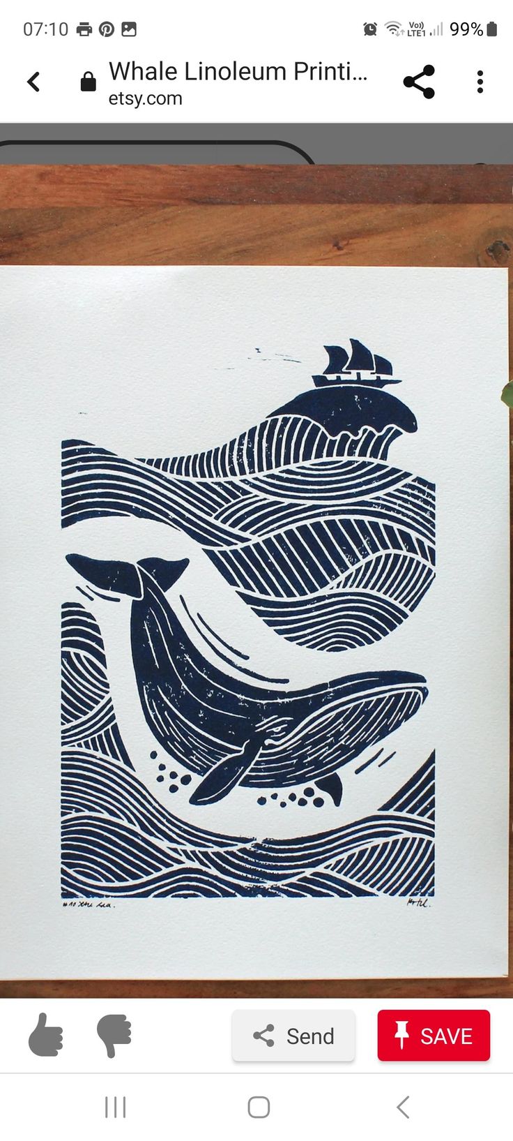 an image of two dolphins in the water on a white paper with blue ink and wood frame