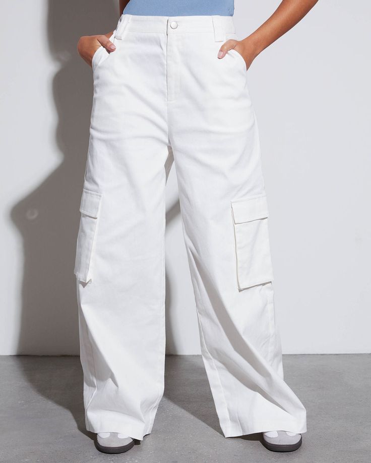 Combine the look of a tailored trouser with the laidback approach of baggy cargo pants and you'll get the Jacklin Cargo Trouser Pants. This pair sits high on the waist and features a wide leg fit. Dress it up or down your way. High rise Fitted waist Wide pant leg Side, back & cargo pockets Front zip fly & button closure 97% Cotton 3% Spandex White High-waist Baggy Cargo Pants, White Baggy Ankle-length Cargo Pants, White Full-length Cargo Jeans With Pockets, White Mid-rise Cargo Pants With Side Pockets, White High-waisted Cotton Cargo Pants, Baggy Cargo Pants, Fit Dress, Wide Pants, Cargo Trousers