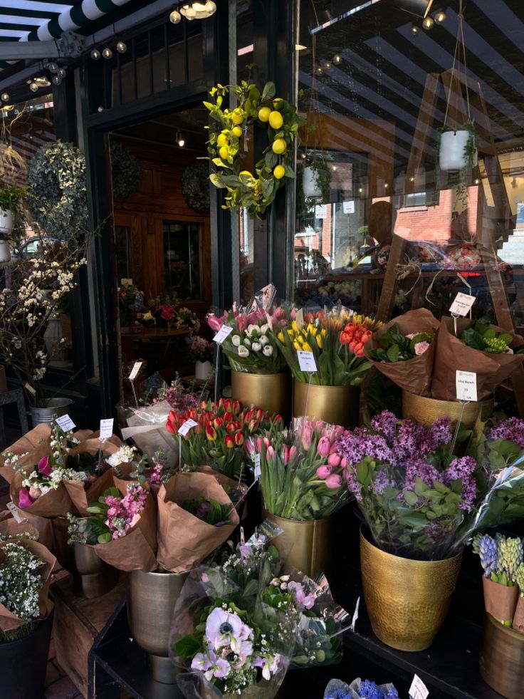 a bunch of flowers that are in some pots