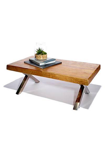 a wooden table with metal legs and a potted plant sitting on top of it