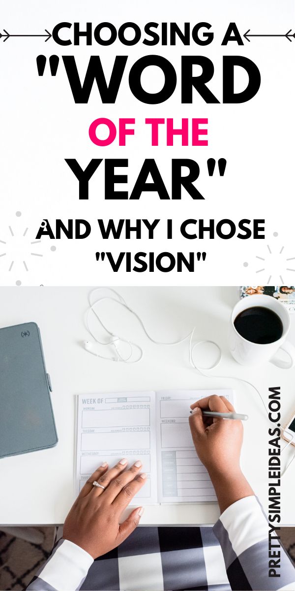 a person writing on a piece of paper with the words choosing a word of the year and why i chose vision