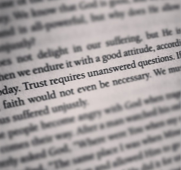 an open book with some type of text on the bottom right hand corner that reads, trust requires unanswered questions if faith would not even be necessary