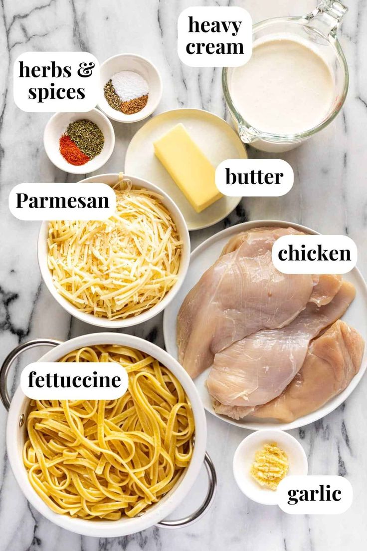 the ingredients to make chicken parmesan pasta are shown in bowls on a marble countertop