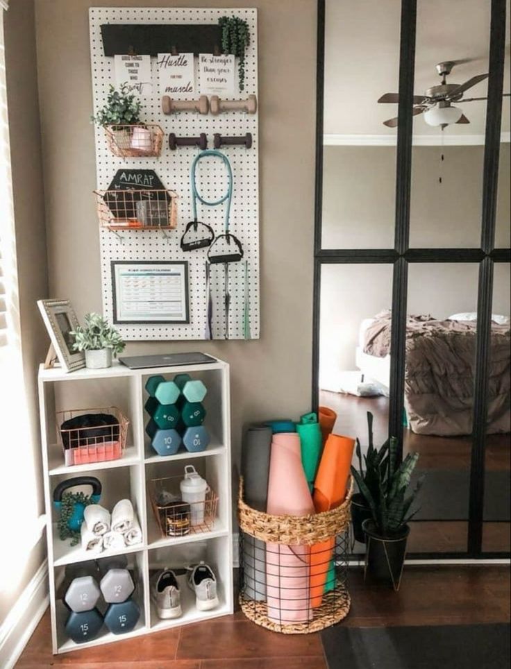 a room filled with lots of different items on shelves next to a mirror and potted plant