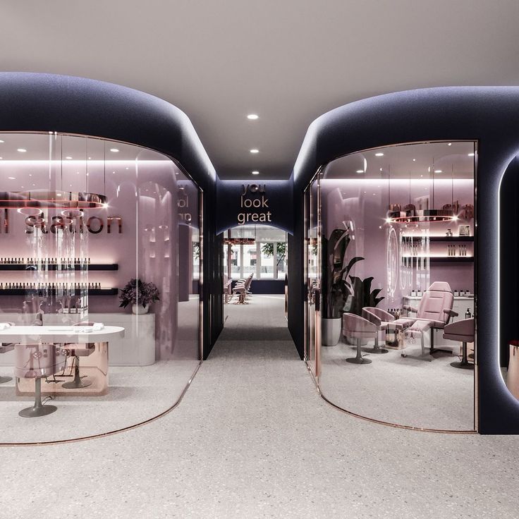 the inside of a store with two circular glass doors and tables in front of them