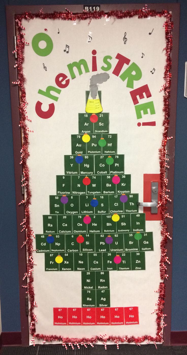 a classroom door decorated with a christmas tree