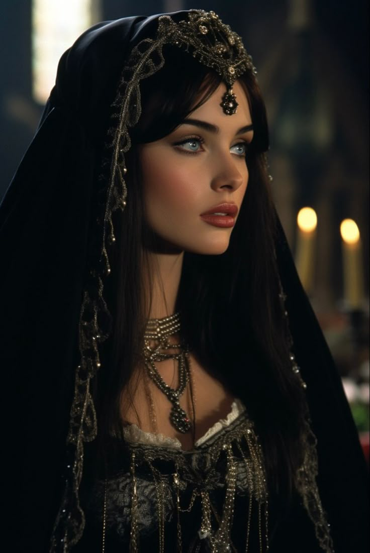 a woman with long hair wearing a black dress and headdress is looking off to the side