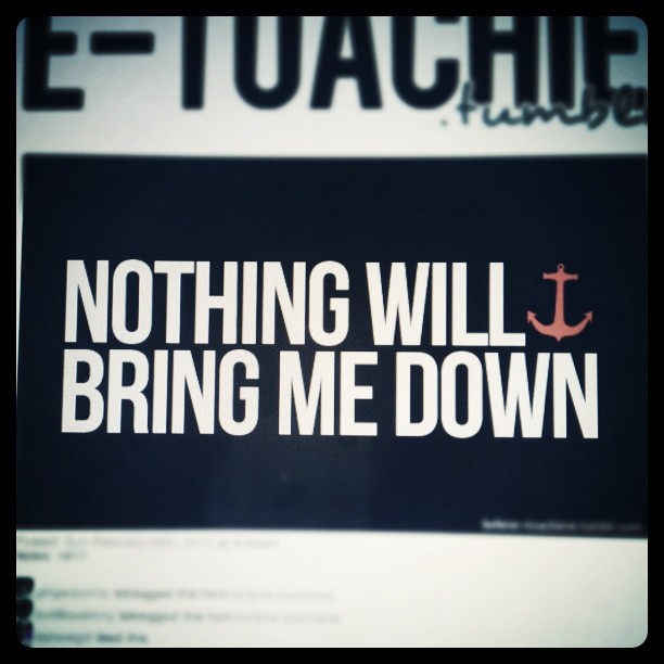 the words nothing will bring me down on a dark background with an anchor in it