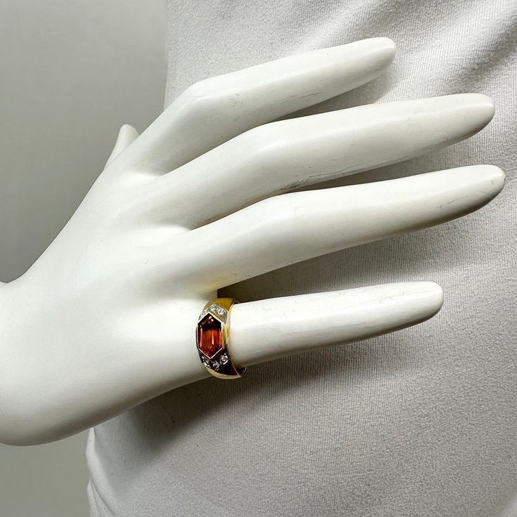 18K Gold Ring with Citrine and Diamonds Designer = Jewelry Size = 5.5 Material = 18K Gold Gemstone = Citrine Condition = Excellent Class = Premier Location: Wilmette Item Number: 11405-1279 Item ID: 283204 Category: Ring Elegant Multi-stone Orange Rings, Elegant Orange Multi-stone Rings, Orange Multi-stone Fine Jewelry Rings, Luxury Topaz And Citrine Ring With Accent Stones, Luxury Citrine Topaz Ring With Accent Stones, Orange Topaz Gemstone Rings, Yellow Gold Citrine Gemstones With Multi-stone Detail, Yellow Gold Citrine Gemstones With Accents, Luxury Citrine Topaz Ring With Gemstone Accents