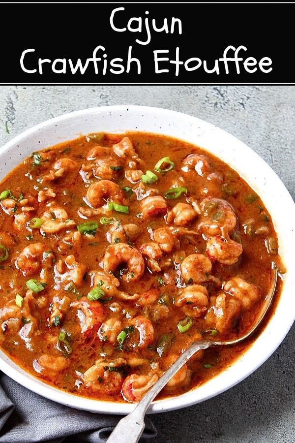 a bowl of cajun crawfish etouffe with a spoon in it