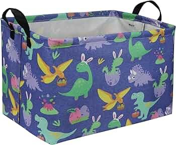 a toy storage box with dinosaurs on blue fabric and black handles, holds two large bins