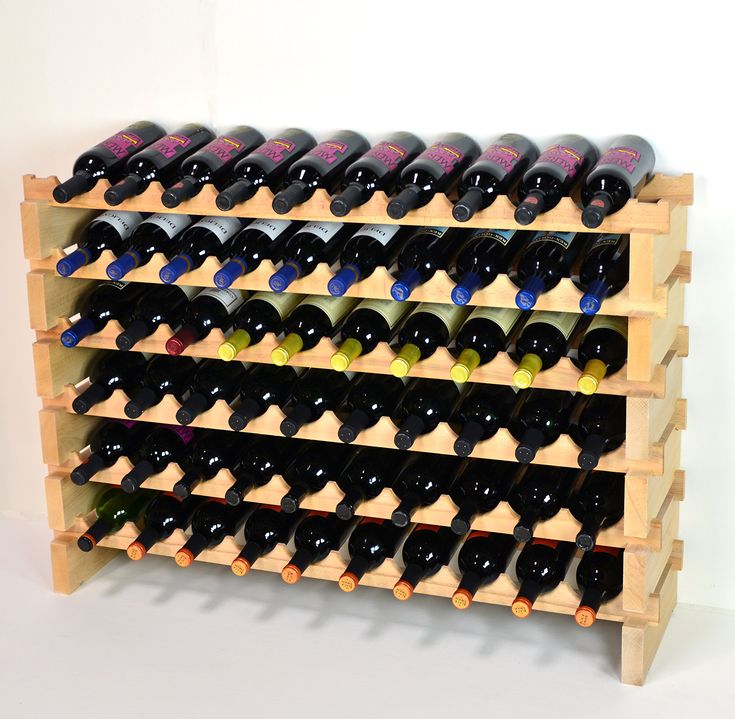 a wooden wine rack filled with lots of bottles