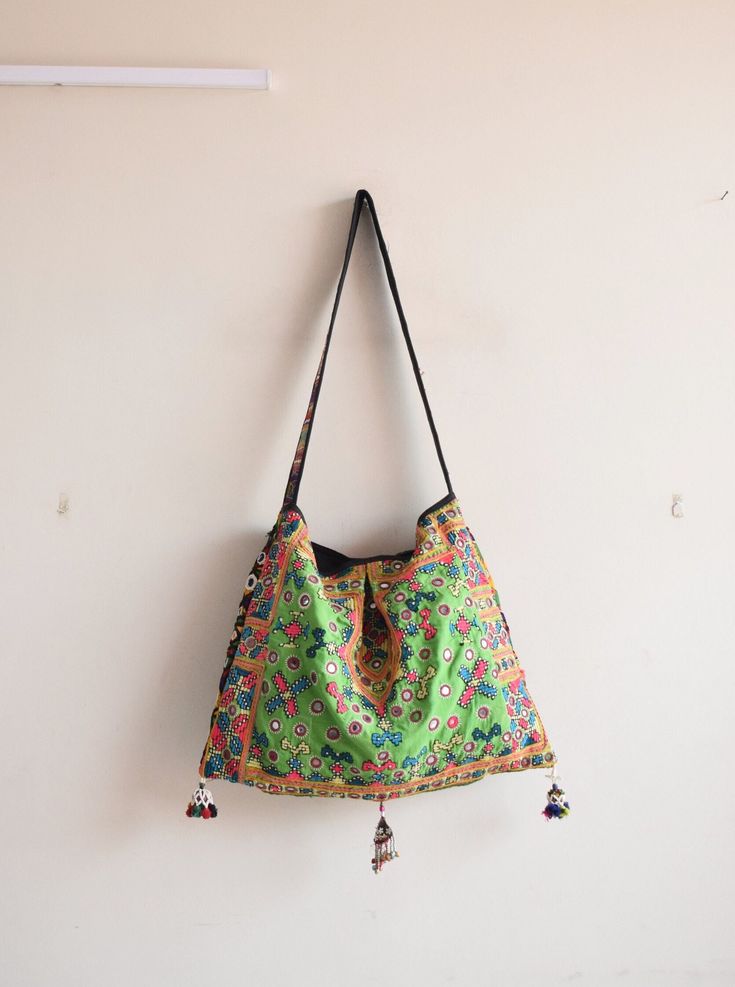 Welcome to HarmonyHandicraftCo Vintage banjara hand embroidery shoulder bag is large enough to hold everything you need throughout your day, Made of antique hand-embroidery. Thread textiles, with intricate embellishments, bag is truly unique. Size in Inches ( Approx ) Height with handle  31 Inches Bag Height - 14 Inches Width - 19 Inside Pocket - 1 Outside Pocket - No Very colorful and striking color purse, It can be a unique gift for girls, girl friends, sisters, daughters. Housewives, and can Handmade Multicolor Embroidered Hobo Bag For Everyday Use, Handmade Multicolor Embroidery Hobo Bag For Everyday Use, Embroidered Rectangular Hobo Bag For Festivals, Handmade Multicolor Embroidery Hobo Bag, Festival Shoulder Bag With Multicolor Floral Embroidery, Festival Shoulder Bag With Floral Embroidery, Multicolor Floral Embroidered Shoulder Bag For Festivals, Floral Embroidered Shoulder Bag For Festivals, Handmade Multicolor Embroidered Tote Shoulder Bag