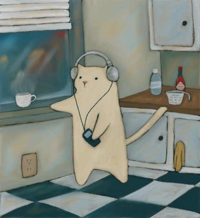 a cat with headphones is dancing in the kitchen