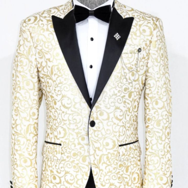 Gold And Ivory Floral Jacket. Single Button Peak Lapel In A Slim Fit. Coat Only. Designer White Blazer For Semi-formal Occasions, White Fall Party Suit, Luxury White Blazer With Buttons, Designer White Blazer With Lapel Collar, White Tuxedo Formal Outerwear, White Notch Lapel Outerwear For Party, White Tuxedo-style Party Outerwear, White Tuxedo Style Party Outerwear, Fitted White Tuxedo With Buttons