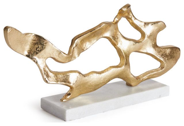 a gold metal sculpture on a white marble base