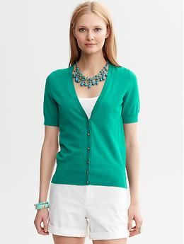 Short-Sleeve Cardigan Elegant Cotton V-neck Cardigan, Classic V-neck Summer Outerwear, Green V-neck Top With Ribbed Cuffs, Classic V-neck Cardigan With Button Cuffs, Elegant Collared Workwear Cardigan, Elegant Collared Cardigan For Work, Elegant Solid V-neck Sweater For Spring, Elegant Collared Sweater With Button Cuffs, Casual V-neck Sweater With Button Cuffs