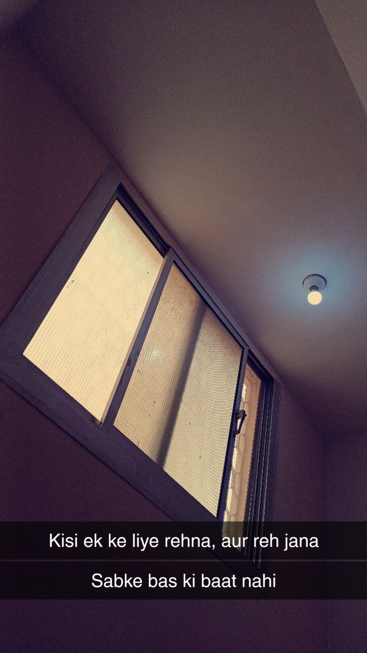 an open window in the corner of a room