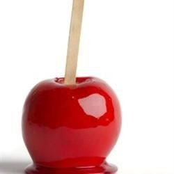 an apple with a toothpick sticking out of it's center, on a white background