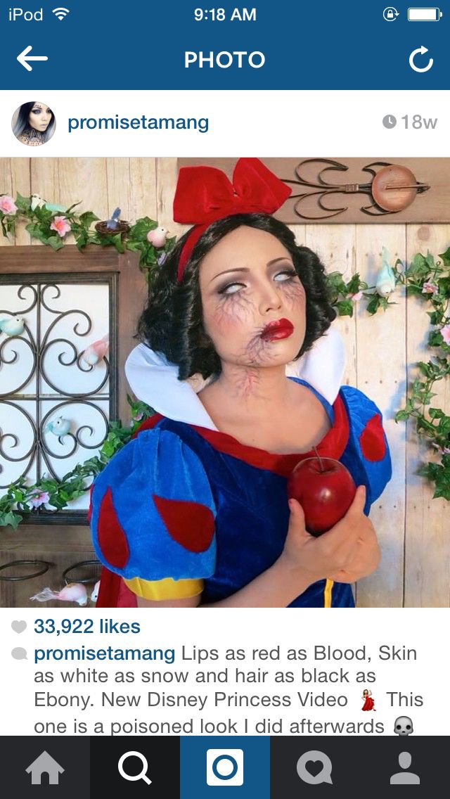 a woman dressed as snow white holding an apple