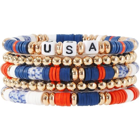 four bracelets with gold beads and usa letters on each beaded stranded bracelet