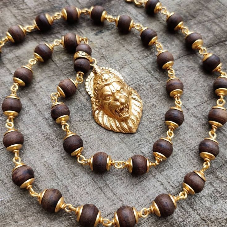 5 micron thick pure Gold plated sterling silver Nrsimha capped Tulasi Mala! We use a very high standard of gold plating to lay as long as possible.
#goldenlion #handmadejewelry #tulasimala #darkwood #narasimha Tulasi Mala In Gold, Men Ornaments, Gold Mala, Tulsi Mala, Mens Bracelet Gold Jewelry, Rudraksha Jewelry, Man Gold Bracelet Design, Doctor Birthday, Golden Rings