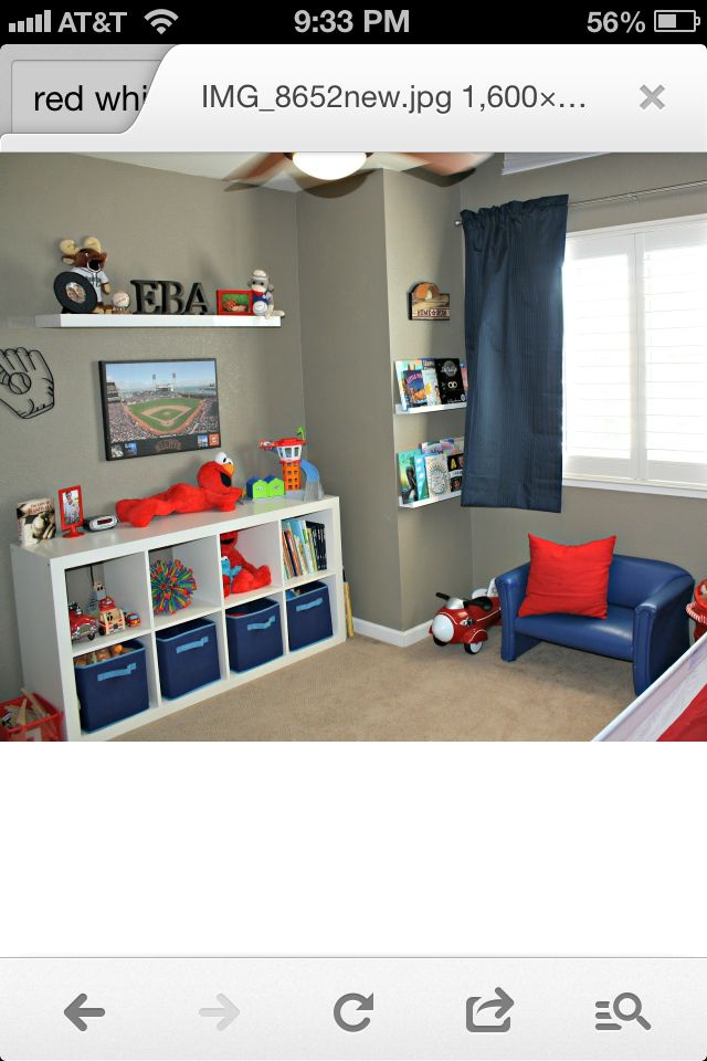 a child's bedroom decorated in blue and red