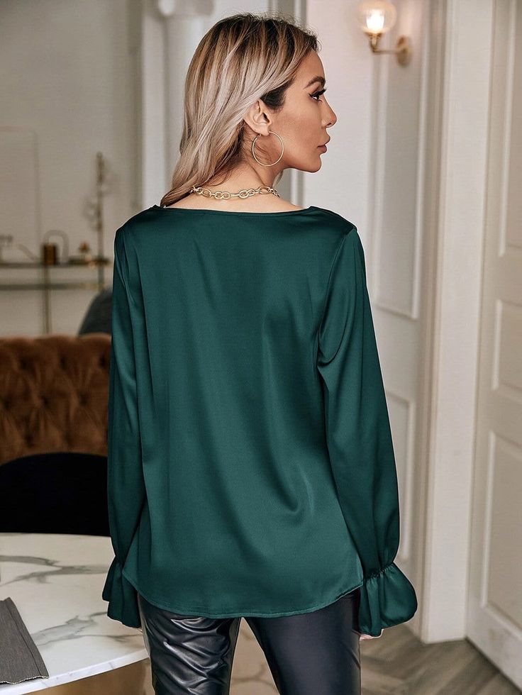 The EMES SHOP blouse is detailed with a classy cowl neck line. Features solid color. long sleeves. ruffle cuffs. and loose fit. Pair it with leather pants and stilettos for a gorgeous look.MATERIAL:100%Soft Poly MEASUREMENTS:Product Length 22"-24"in Small | Bust & Hem Width : 35"-37"in Medium| Bust & Hem Width : 37"-39"in Large| Bust & Hem Width : 39"-41"in X Large| Bust & Hem Width : 41"-43"in MEASUREMENTS:Product Length 55"-60"cm Small | Bust & Hem Width : 88"-93"cm Medium| Bust & Hem Width : 93"-98"cm Large| Bust & Hem Width : 98"-103"cm X Large| Bust & Hem Width : 103"-108"cm Elegant Blouse With Lantern Sleeves In Solid Color, Elegant Lantern Sleeve Blouse In Solid Color, Fall Formal Solid Color Blouse, Elegant Long Sleeve Top For Fall, Fall Bell Sleeve Blouse For Workwear, Chic Formal Blouse With Bell Sleeves, Elegant Long Sleeve Top For Winter Party, Elegant Long Sleeve Top For Fall Party, Elegant Long Sleeve Party Top For Winter