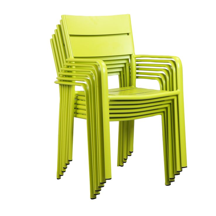 four lime green plastic chairs stacked on top of each other