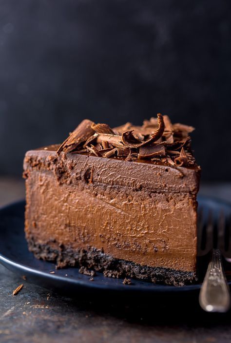 a piece of chocolate cake on a plate with a fork