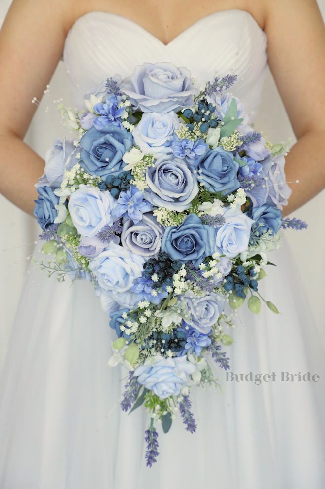 a bridal holding a bouquet of blue flowers