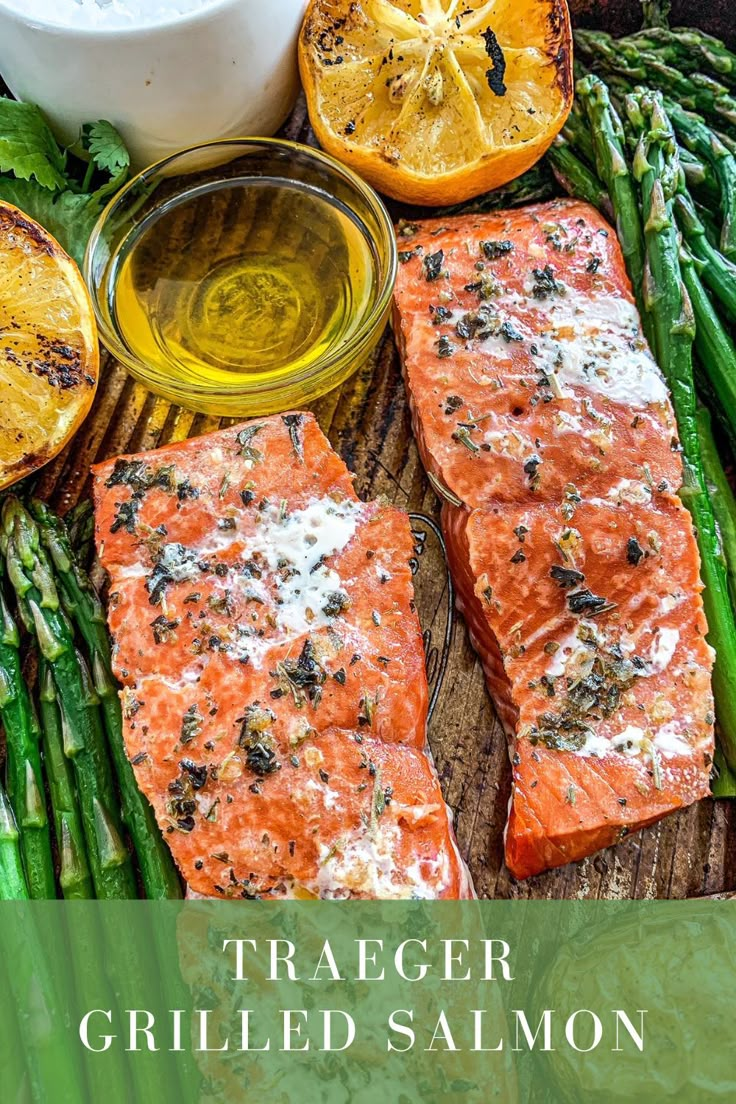 grilled salmon and asparagus on a cutting board with lemons, parmesan cheese and herbs