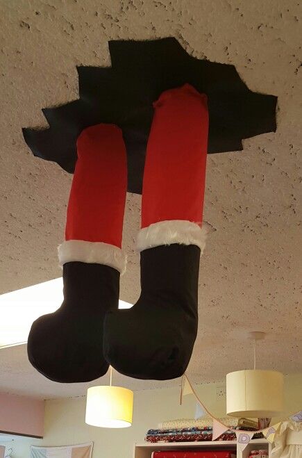 a pair of christmas stockings hanging from the ceiling