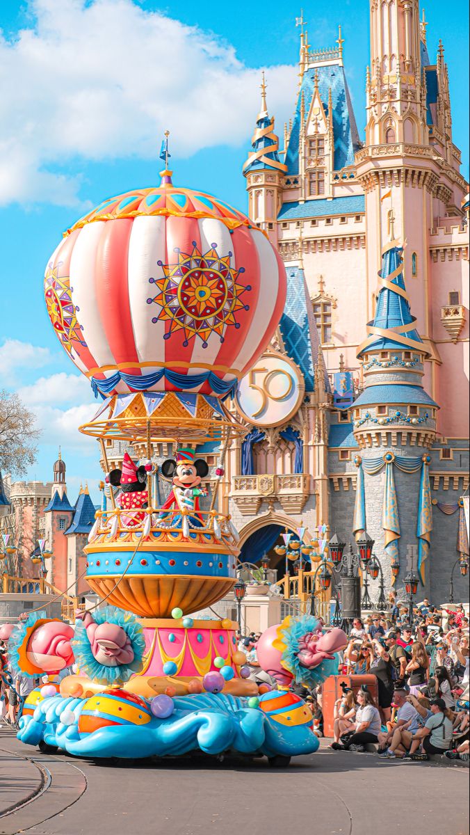 an amusement park float with people watching it