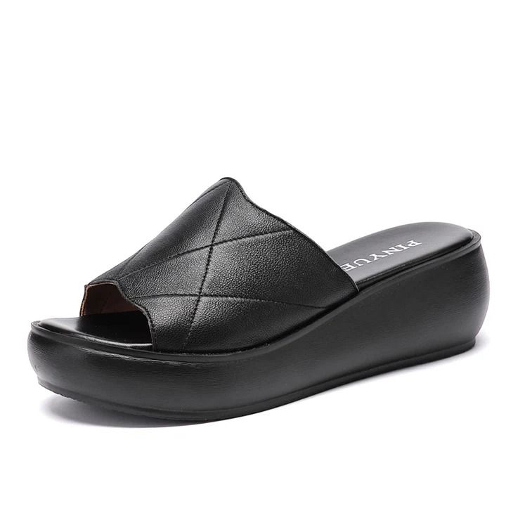 These Aurora women's platform slippers by USS Shoes feature genuine leather uppers, a patterned geometric design, and a TPU outsole. Fitting true to size, are finished with a lightweight and flexible latex insole. The platform wedge gives them a fashionable edge while providing comfortable support, making them perfect for both indoor and outdoor wear. They are soft and comfortable, wear your best color black, green or red, and you will look stylish. Modern Platform Slippers With Wedge Heel And Removable Insole, Trendy Leather Platform Slippers With Textured Footbed, Modern Platform Slippers With Cushioned Wedge Heel, Modern Platform Slippers With Cushioned Footbed And Wedge Heel, Modern Platform Slippers With Cushioned Footbed, Modern Platform Slide Slippers With Cushioned Footbed, Modern Cushioned Platform Slide Slippers, Synthetic Slide Wedge Sandals With Textured Sole, Leather Platform Slippers With Wedge Heel