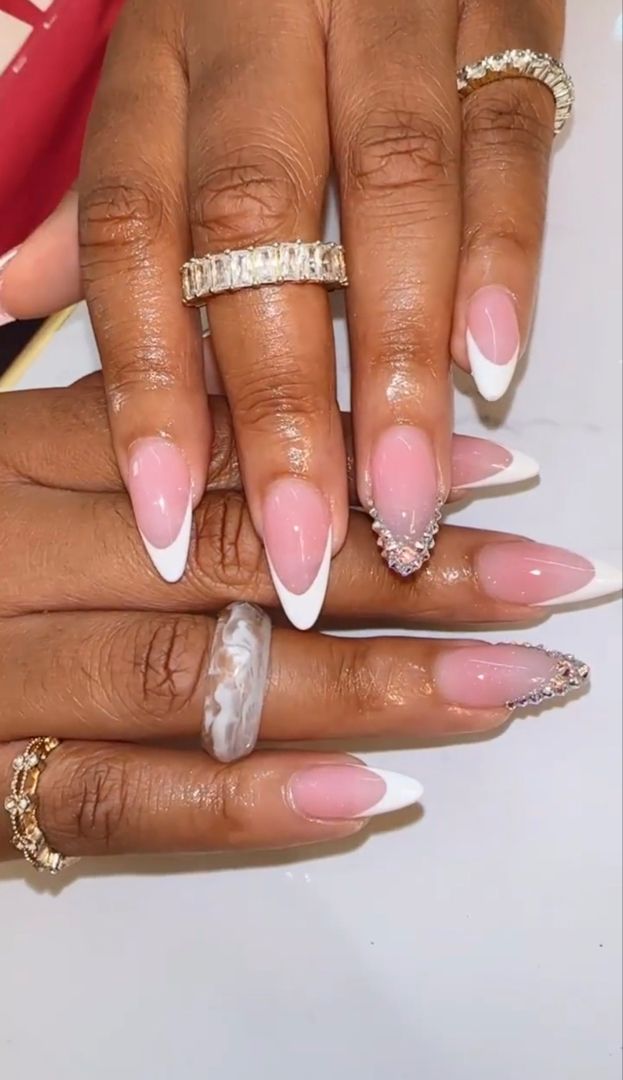 Oval French Tip Nails With Diamonds, Almond Nails French Tip With Gems, French Nails On Black Women, Black French Top With Gems, Almond Shape French Tip Design, Almond Shape Nails With Rhinestones, High Arch French Tip Nails, French Nail With Gems, French Tip Nails With Righnstones