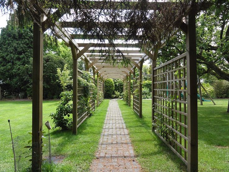 a walkway in the middle of a grassy area