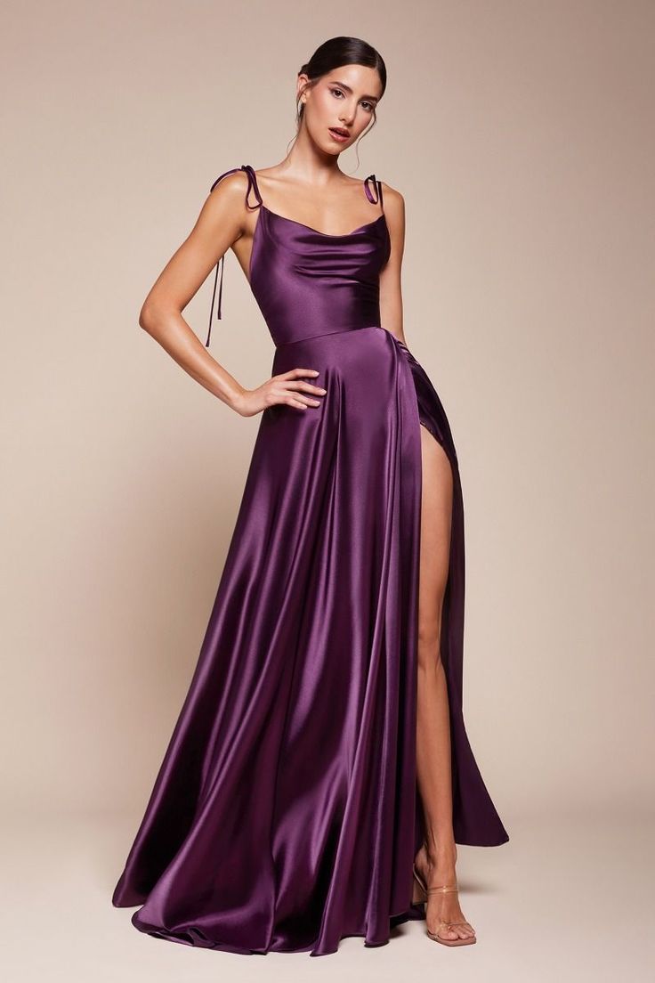 This best-selling design has been reimagined for the trend-forward Bridesmaid. The Hestia Gown is a modern romantic gown created with flowy silky fabrication for an elegant silhouette. This silky piece features adjustable spaghetti shoulder ties for a truly custom fit and a cowl neckline that falls naturally along the chest. Note: This is a final sale clearance item and cannot be returned or exchanged. Romantic Gown, Simple Satin, Cinderella Divine, Drape Maxi Dress, Mens Jackets Casual, Selling Design, Divine Design, Designer Drapes, Satin Gown