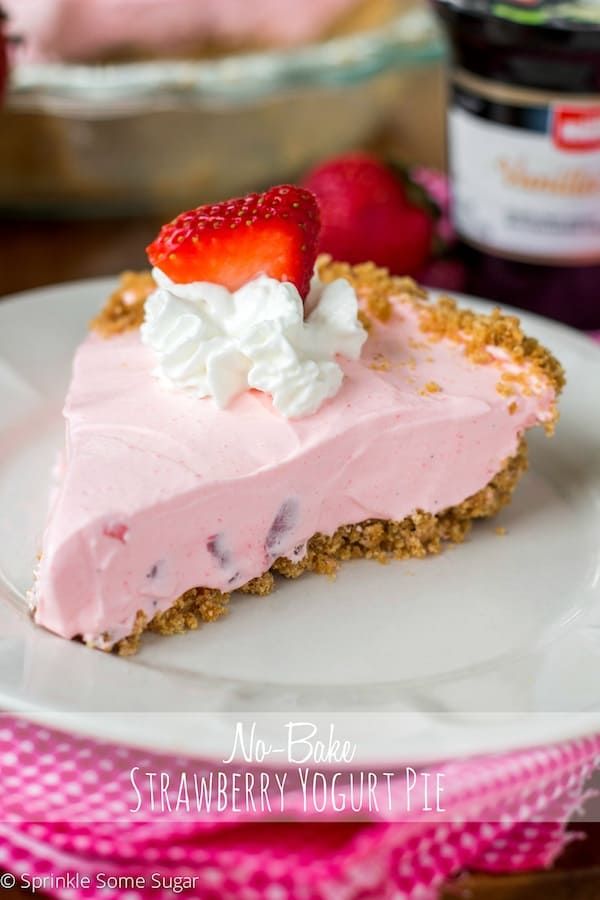 a slice of strawberry cream pie on a white plate